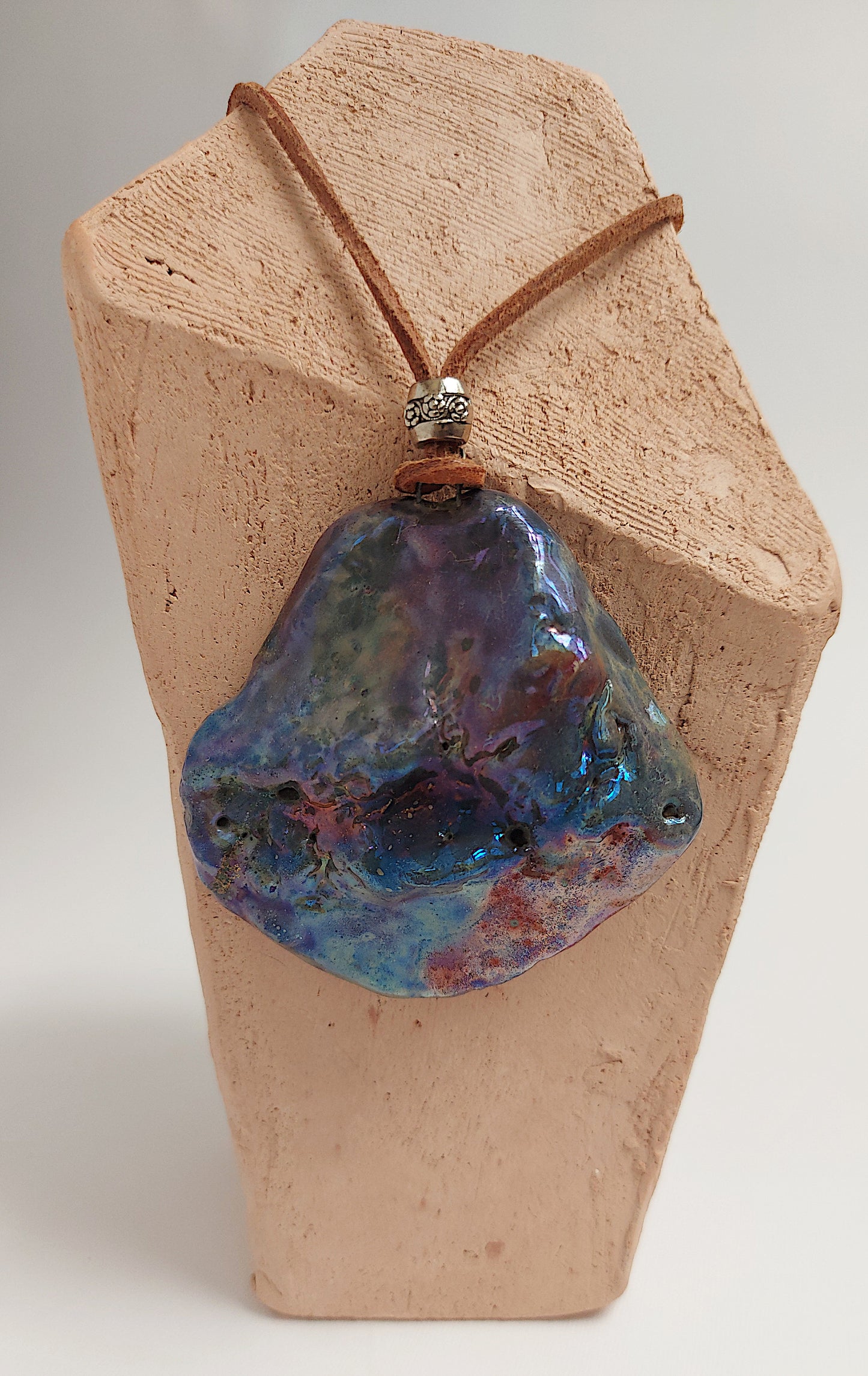 Double face pendant with one textured and one smooth side By Marwa Zakaria