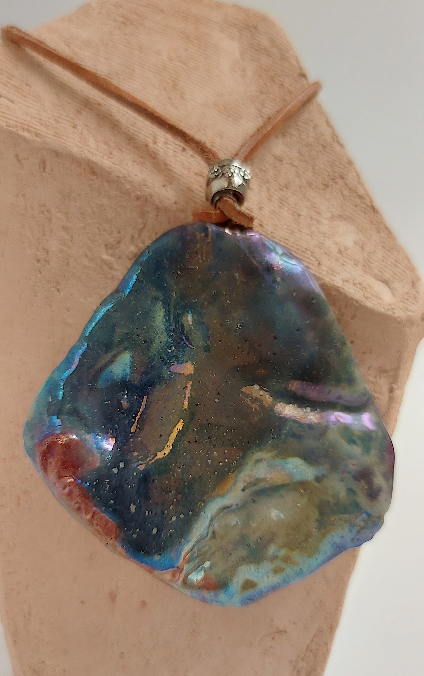 Double face pendant with one textured and one smooth side By Marwa Zakaria