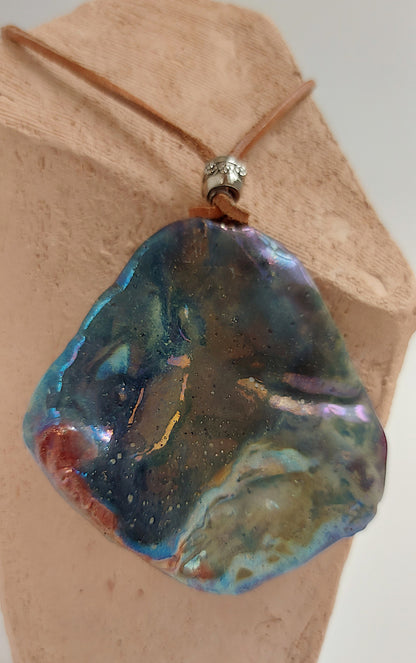 Double face pendant with one textured and one smooth side By Marwa Zakaria